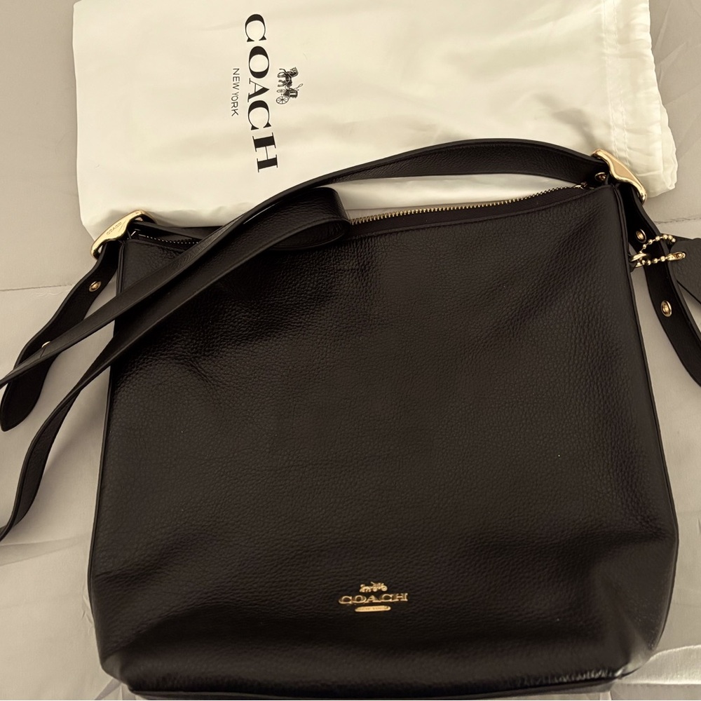 Large Black Coach genuine leather handbag. Dust bag included. Like new.